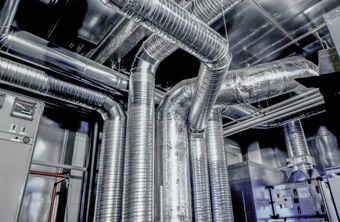 A close-up view of a ductwork system in a residential or commercial building.