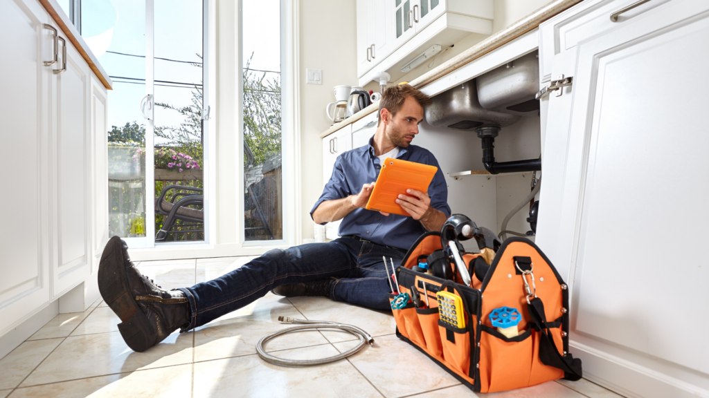Plumber repairing a sink in Akron