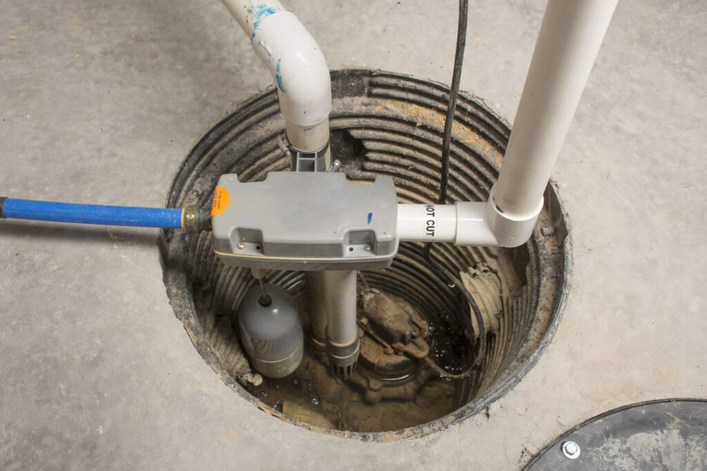 a sump pump installed in a basement of a home with a water powered backup system